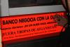 Acto de protesta por el negocio de la guerra de los bancos y cajas en Sevilla